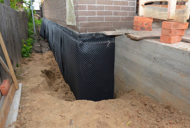 Happy homeowners after waterproofing job in Lemont